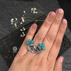Mewad double peacock adjustable ring. Handcrafted in 92.5 sterling silver with turquoise stones.