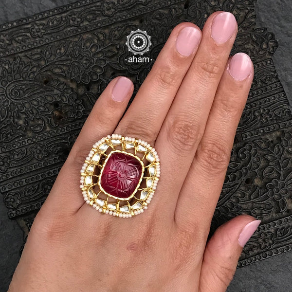 Gold polish deep pink precious stone ring with Kundan work. Beautiful and wearable adjustable ring crafted in 92.5 sterling silver with cultured pearls. Perfect for special occasions and festivities. 