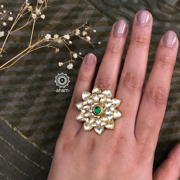 Festive gold polish adjustable ring kundan stone setting. Handcrafted in 92.5 sterling silver with elegant floral work including green coloured centre. Perfect for special occasions and festivities. 