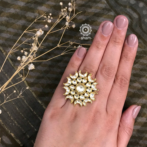 Festive gold polish adjustable ring with kundan stone setting. Handcrafted in 92.5 sterling silver with elegant geometric patterns. Perfect for special occasions and festivities. 