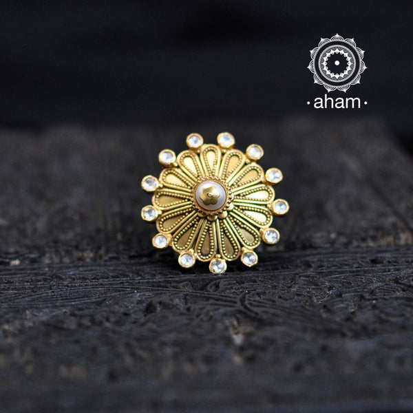 Festive gold polish adjustable ring including elegant kundan work. Handcrafted in 92.5 sterling silver with 3D cultured pearl crown. Perfect for special occasions and festivities. 