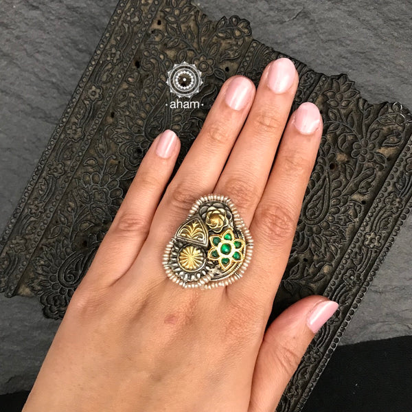 One of a kind meticulous pieces created by skilled artisans put together. Creating this Noori two tone adjustable ring. Crafted in 92.5 sterling silver with green spinel, floral motif, gold polish, embellished cultured pearls.