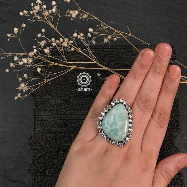 Ira adjustable ring, handcrafted intricately in 92.5 sterling silver with semi precious stone and zircon highlights. Perfect for special occasions and festivities.