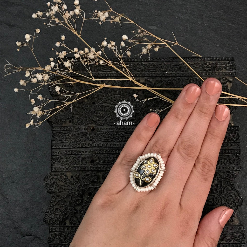 Ira adjustable ring, handcrafted intricately in 92.5 sterling silver with semi precious stone and Kundan inlay work. Perfect for special occasions and festivities.