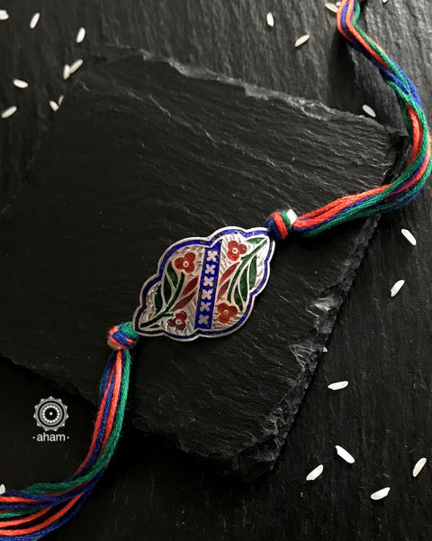 Easy to tie,  Elegant Floral motif in 925 sterling silver rakhi for your brother weaved in Multi Colour cotton thread . Traditional Handcrafted 925 Silver rakhi. Also avaialble  Rakhi made with Ganapati, Trishul  and Om symbol. Starting with Rs.  551,  wide range of silver rakhi , 50+ rakhi designs. Gift for Sister. worldwide Shipping. Buy 925  Sterling Silver Rakhi Collection Online India.  Shop Now.