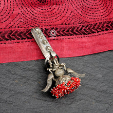 Handcrafted 92.5 sterling silver key chain with Ganesha motif, elegant peacock motif and coral stones dangling to a chitai work jhumka. Also known as Challah, Juda, Chatka and Guchha.