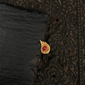 Handcrafted silver wired nosepin with gold polish.