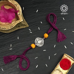 Easy to tie,  Elegant Leaf Rakhi in 925 sterling silver for your brother weaved in Purple Colour cotton thread . Traditional Handcrafted 925 Silver rakhi. Also avaialble  Rakhi made with Ganapati, Trishul  and Om symbol. Starting with Rs.  551,  wide range of silver rakhi , 50+ rakhi designs. Gift for Sister. worldwide Shipping. Buy 925  Sterling Silver Rakhi Collection Online India.  Shop Now.