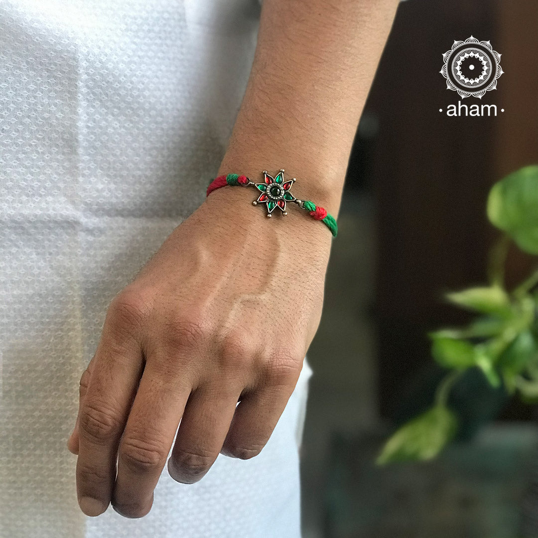 Easy to tie, Elegant Floral motif in 925 sterling silver rakhi for your brother weaved in red and Green Colour cotton thread . Traditional Handcrafted 925 Silver rakhi. Also avaialble Rakhi made with Ganapati, Trishul and Om symbol. Starting with Rs. 551, wide range of silver rakhi , 50+ rakhi designs. Gift for Sister. worldwide Shipping. Buy 925 Sterling Silver Rakhi Collection Online India. Shop Now.