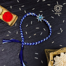 Easy to tie,  Elegant Floral Motif Rakhi in 925 sterling silver for your brother weaved in Blue Colour cotton thread and pearls. Traditional Handcrafted 925 Silver rakhi. Also avaialble  Rakhi made with Ganapati, Trishul  and Om symbol. Starting with Rs.  551,  wide range of silver rakhi , 50+ rakhi designs. Gift for Sister. worldwide Shipping. Buy 925  Sterling Silver Rakhi Collection Online India.  Shop Now.
