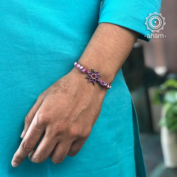 Easy to tie, Elegant Flower motif in 925 sterling silver rakhi for your brother weaved in Pink and Purple colour cotton thread and Pearls.. Traditional Handcrafted 925 Silver rakhi. Also avaialble Rakhi made with Ganapati, Trishul and Om symbol. Starting with Rs. 551, wide range of silver rakhi , 50+ rakhi designs. Gift for Sister. worldwide Shipping. Buy 925 Sterling Silver Rakhi Collection Online India. Shop Now.