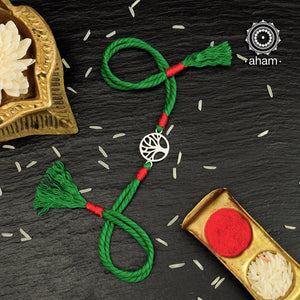 Easy to tie,  Elegant Tree Symbol Rakhi in 925 sterling silver for your brother weaved in Green and Red Colour cotton thread . Traditional Handcrafted 925 Silver rakhi. Also avaialble  Rakhi made with Ganapati, Trishul  and Om symbol. Starting with Rs.  551,  wide range of silver rakhi , 50+ rakhi designs. Gift for Sister. worldwide Shipping. Buy 925  Sterling Silver Rakhi Collection Online India.  Shop Now.
