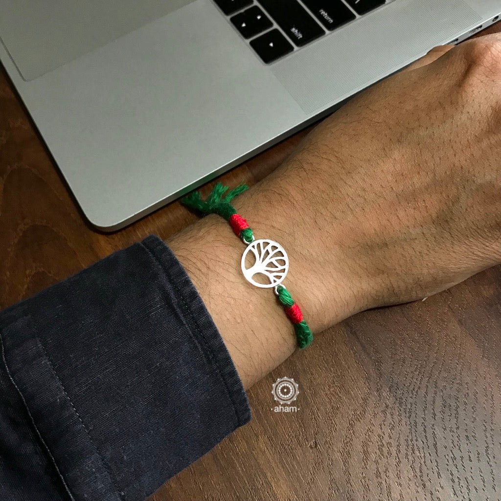 Easy to tie, Elegant Tree Symbol Rakhi in 925 sterling silver for your brother weaved in Green and Red Colour cotton thread . Traditional Handcrafted 925 Silver rakhi. Also avaialble Rakhi made with Ganapati, Trishul and Om symbol. Starting with Rs. 551, wide range of silver rakhi , 50+ rakhi designs. Gift for Sister. worldwide Shipping. Buy 925 Sterling Silver Rakhi Collection Online India. Shop Now.