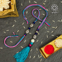 Easy to tie,  Elegant Silver Beads Rakhi and Lumba Set in 925 sterling silver for your Bhaiya and Bhabhi weaved in Blue and Pink colour cotton thread . Traditional Handcrafted 925 Silver rakhi. Also avaialble  Rakhi made with Ganapati, Trishul  and Om symbol. Starting with Rs.  551,  wide range of silver rakhi , 50+ rakhi designs. Gift for Sister. worldwide Shipping. Buy 925  Sterling Silver Rakhi Collection Online India.  Shop Now.