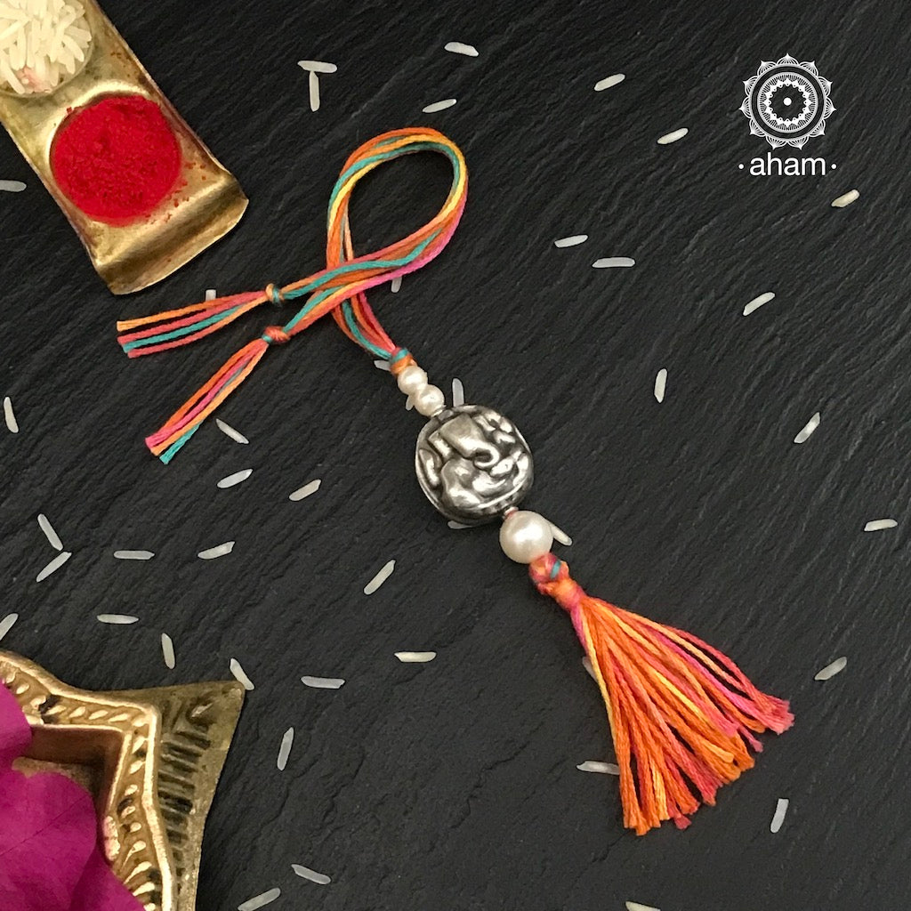 Easy to tie,  Elegant Ganapati Symbol in 925 sterling silver lumba rakhi for Bhabhi, weaved in red colour cotton thread. Traditional Handcrafted 925 Silver lumba  rakhi. Also avaialble  Rakhi made with Om symbol. Starting at Rs. 551,  wide range of silver rakhi , 50+ rakhi designs. Gift for Sister. worldwide Shipping. Buy 925 Silver Rakhi Collection Online India.  Shop Now.