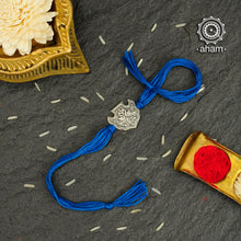 Easy to tie,  Elegant Peacock Dial Rakhi  in 925 sterling silver for your brother weaved in Blue colour cotton thread . Traditional Handcrafted 925 Silver rakhi. Also avaialble  Rakhi made with Ganapati, Trishul  and Om symbol. Starting with Rs.  551,  wide range of silver rakhi , 50+ rakhi designs. Gift for Sister. worldwide Shipping. Buy 925  Sterling Silver Rakhi Collection Online India.  Shop Now.