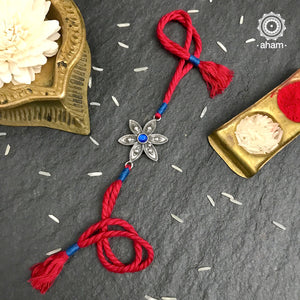 Easy to tie,  Elegant Floral motif in 925 sterling silver rakhi for your brother weaved in Red and Blue colour cotton thread . Traditional Handcrafted 925 Silver rakhi. Also avaialble  Rakhi made with Ganapati, Trishul  and Om symbol. Starting with Rs.  551,  wide range of silver rakhi , 50+ rakhi designs. Gift for Sister. worldwide Shipping. Buy 925  Sterling Silver Rakhi Collection Online India.  Shop Now.