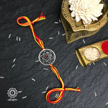 Easy to tie,  Elegant Floral motif in 925 sterling silver rakhi for your brother weaved in Red and Yellow colour cotton thread . Traditional Handcrafted 925 Silver rakhi. Also avaialble  Rakhi made with Ganapati, Trishul  and Om symbol. Starting with Rs.  551,  wide range of silver rakhi , 50+ rakhi designs. Gift for Sister. worldwide Shipping. Buy 925  Sterling Silver Rakhi Collection Online India.  Shop Now.