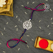 Beautiful Silver Rakhi  Make this Rakshabandhan Memorable with this handcrafted 92.5 Sterling Silver Rakhi   Silver dial weaved with cotton thread for an ever-lasting Knot.  The Dial comes with a loop so you can later use it as a pendant as well. 