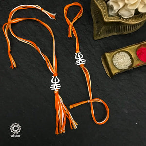 Make this Rakshabandhan Memorable with this handcrafted Trishul  Rakhi Lumba set crafted in 925 Silver and weaved with cotton thread.   Roli (kumkum), Akshat (Chawal) and Mishri shipped along with India orders only  Tip: you can later convert this into a key chain charm or a pendant as well  Please note, Rakhi Orders will be packed and shipped in a single box only and not multiple boxes.