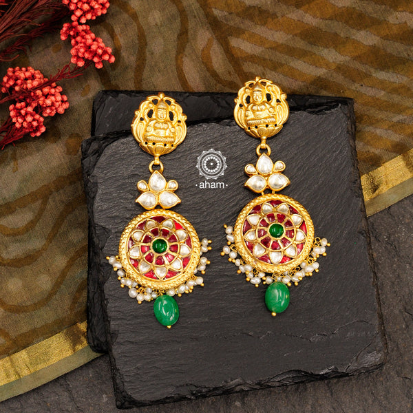 Make a sophisticated style statement this festive season with this floral choker set with semi precious green beads. Handcrafted using traditional kundan jadua techniques in 92.5 sterling silver with cultured pearls. The earrings have a intricate goddess Lakshmi motif. 