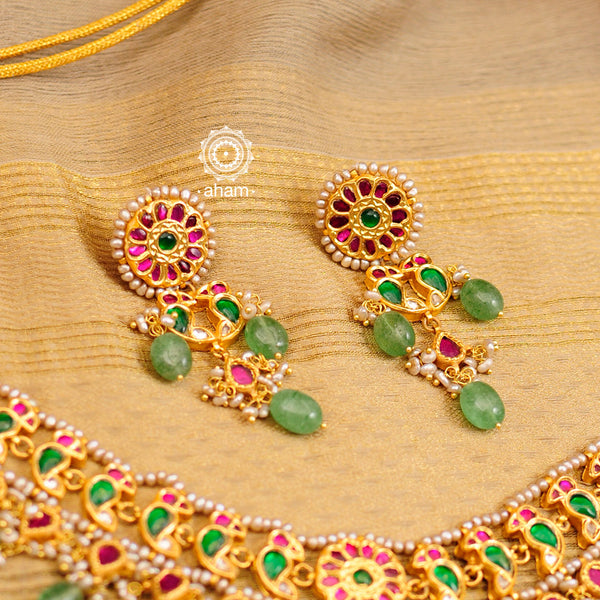 Make a sophisticated style statement this festive season with our beautiful parrot neckpiece and earrings set. Crafted using traditional techniques in 92.5 sterling silver with gold polish, semi precious green stones converted into beads and cultured pearls. Perfect for intimate weddings and upcoming festive celebrations.