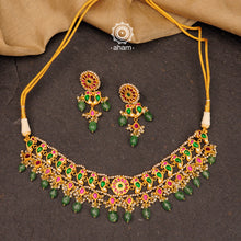 Make a sophisticated style statement this festive season with our beautiful parrot neckpiece and earrings set. Crafted using traditional techniques in 92.5 sterling silver with gold polish, semi precious green stones converted into beads and cultured pearls. Perfect for intimate weddings and upcoming festive celebrations.