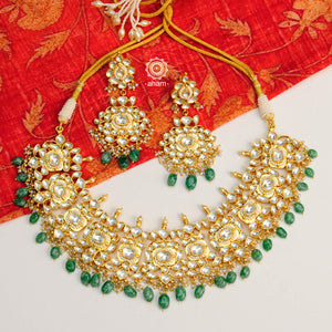 Classic Kundan neckpiece crafted in 92.5 silver and dipped in Gold. Beautiful Pearl and green bead embellishments that makes this a great addition to your wardrobe.  Perfect for intimate weddings and upcoming festive celebrations.