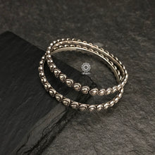 Handcrafted everyday wear bangles in 92.5 sterling silver with intricate heart shaped design.
