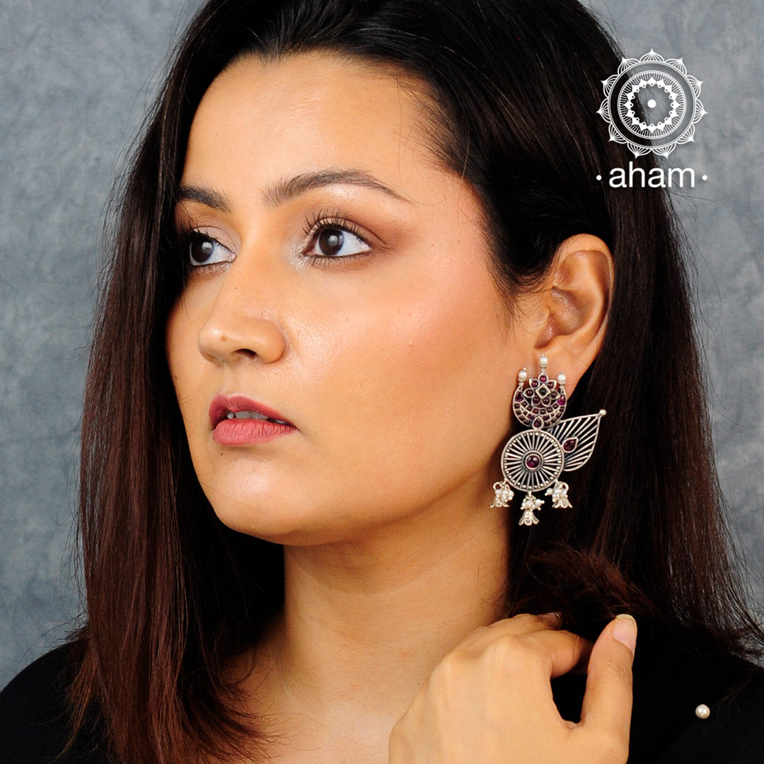 Handcrafted 92.5 sterling Silver earring from our Malhar collection.  hand silver work, with kemp stone highlights and laced with pearls