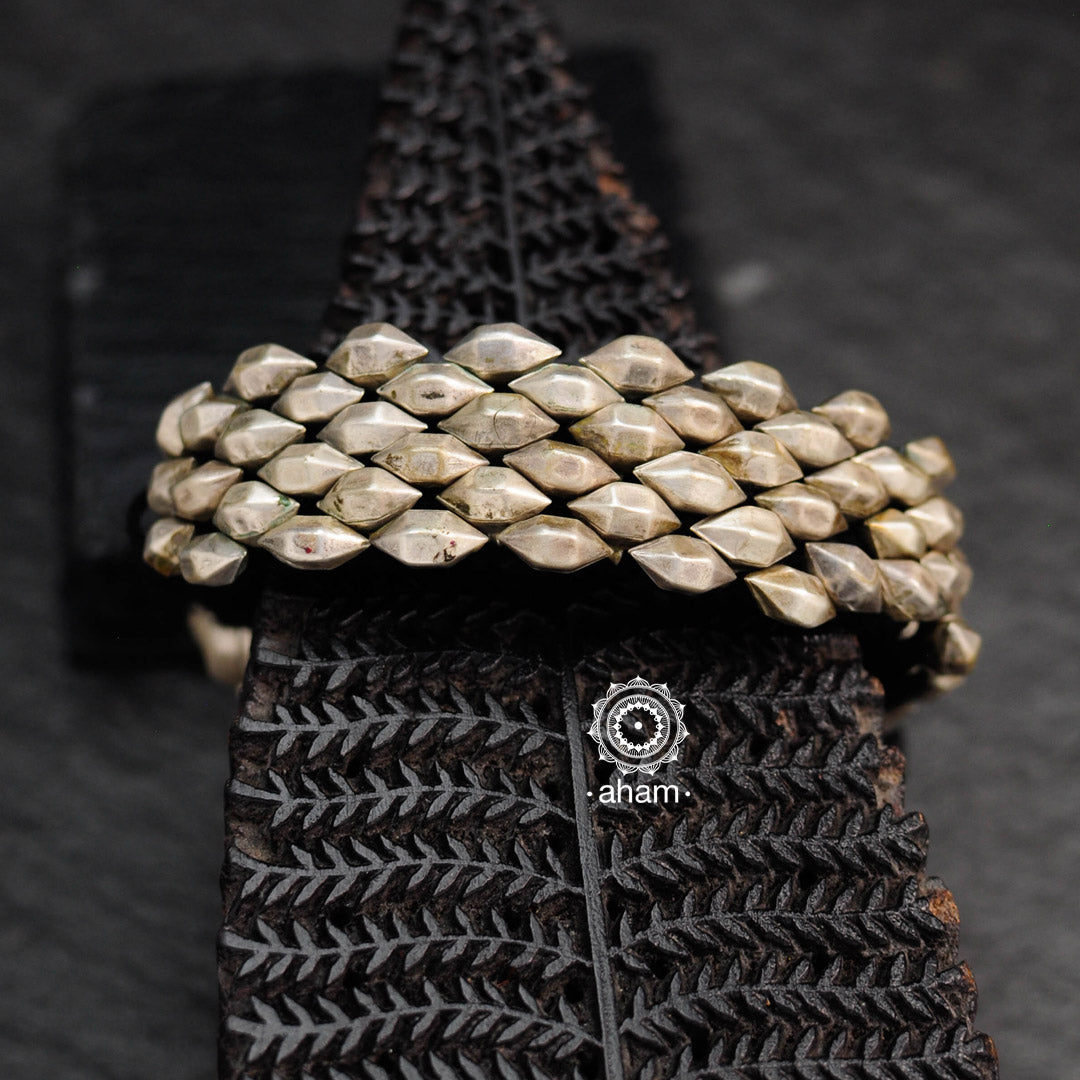 Tribal pauchi with silver bead work, handcrafted by skilful artisans. Beautiful kada from a bygone era, that bring back memories and stories of that time. Please note we have not changed the threading of this vintage pauchi. 