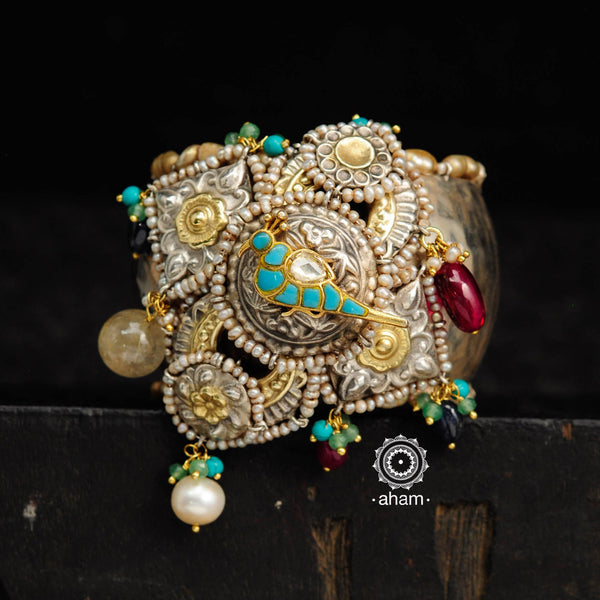 Noori two tone silver open hand cuff with a vibrant bird motif. An eclectic mix of elements, with a play of colours, textures, forms and workmanship. Handcrafted in 92.5 sterling silver with dual tones that make them so versatile and unique. Modern Heirloom pieces that can be worn across generations. 
