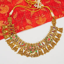 Traditional Jewellery perfect for family weddings.  Beautiful antique finish neckpiece set intricately embedded in the lustre of precious coloured stones. A stunning addition to your wedding look. The beautiful workmanship is something that can be cherished and passed on for generations to come. 